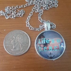Life's a b.e.a.c.h. glass dome necklace